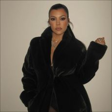 Kourtney Kardashian nailed postpartum fashion in just a coat. 