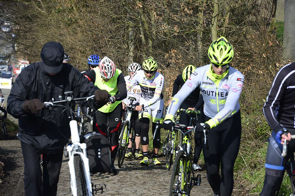 Filippo Pozzato and his Southeast teammates take a stroll up the Koppenberg with the cyclotourists