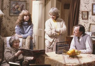 Susan Tully as Michelle Fowler in a classic EastEnders scene with Lou Beale (played by Anna Wing), Pauline Fowler (Wendy Richard) and Arthur Fowler (Bill Treacher)