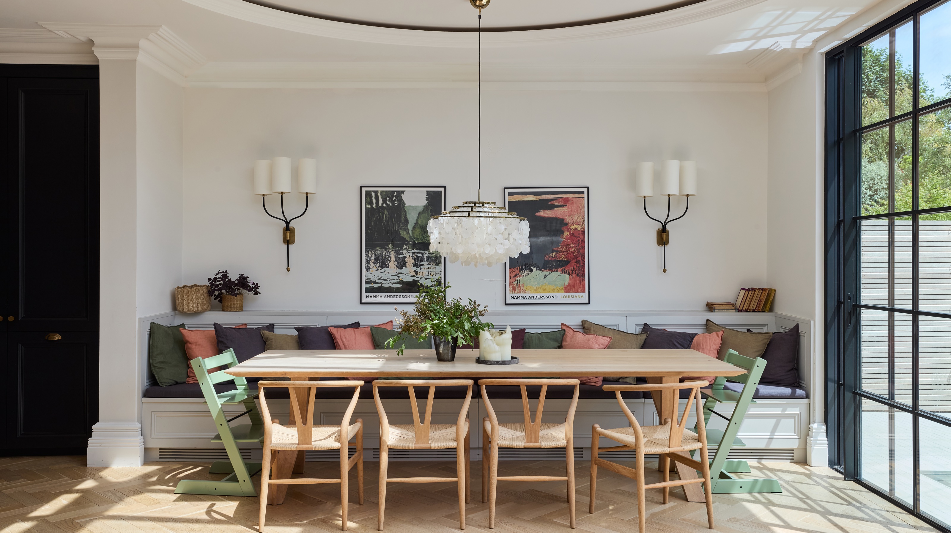 kitchen dining room with large chandelier over kitchen table by Imperfect Interiors