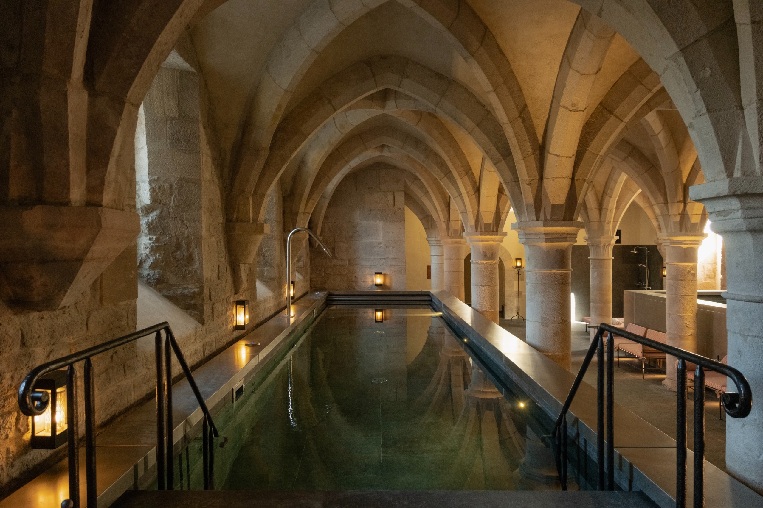Swimming pool in a very old medieval stone building. Like if you put a swimming pool in a church, it would look like this.