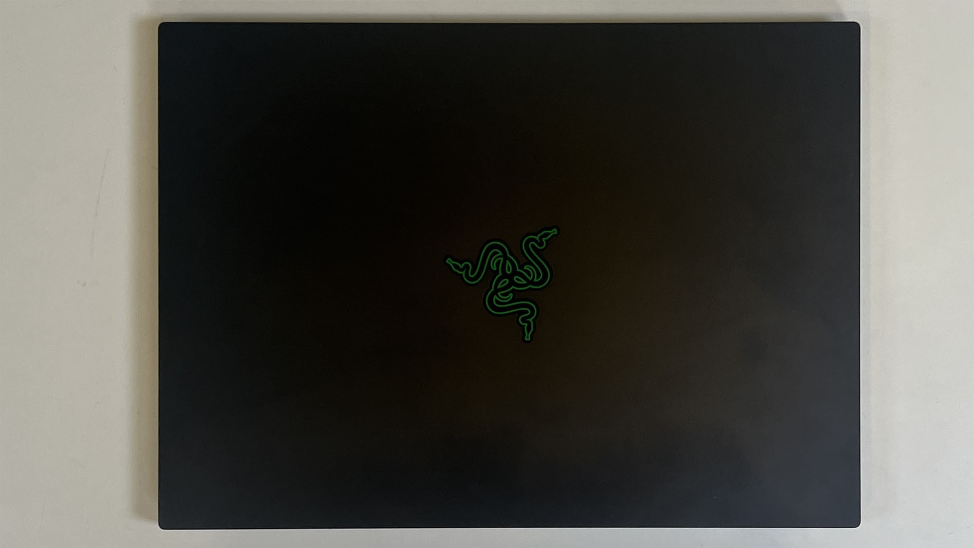 A Razer Blade 14 (2025) on a desk with its lid closed