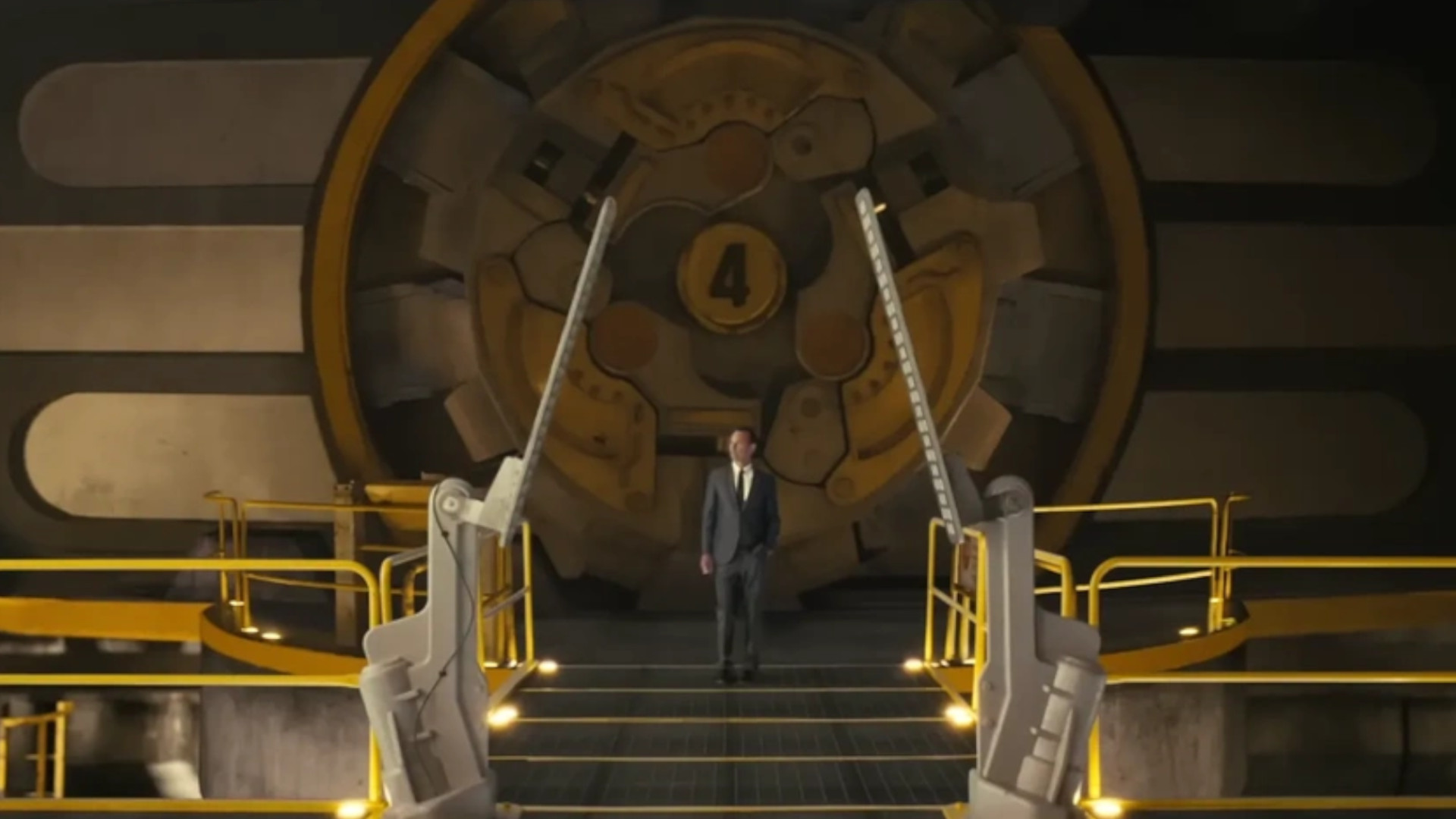 A man in a suit standing outside Vault 4 during season 1 of the Fallout TV show.
