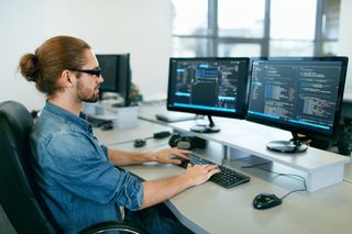 Software developer working on code