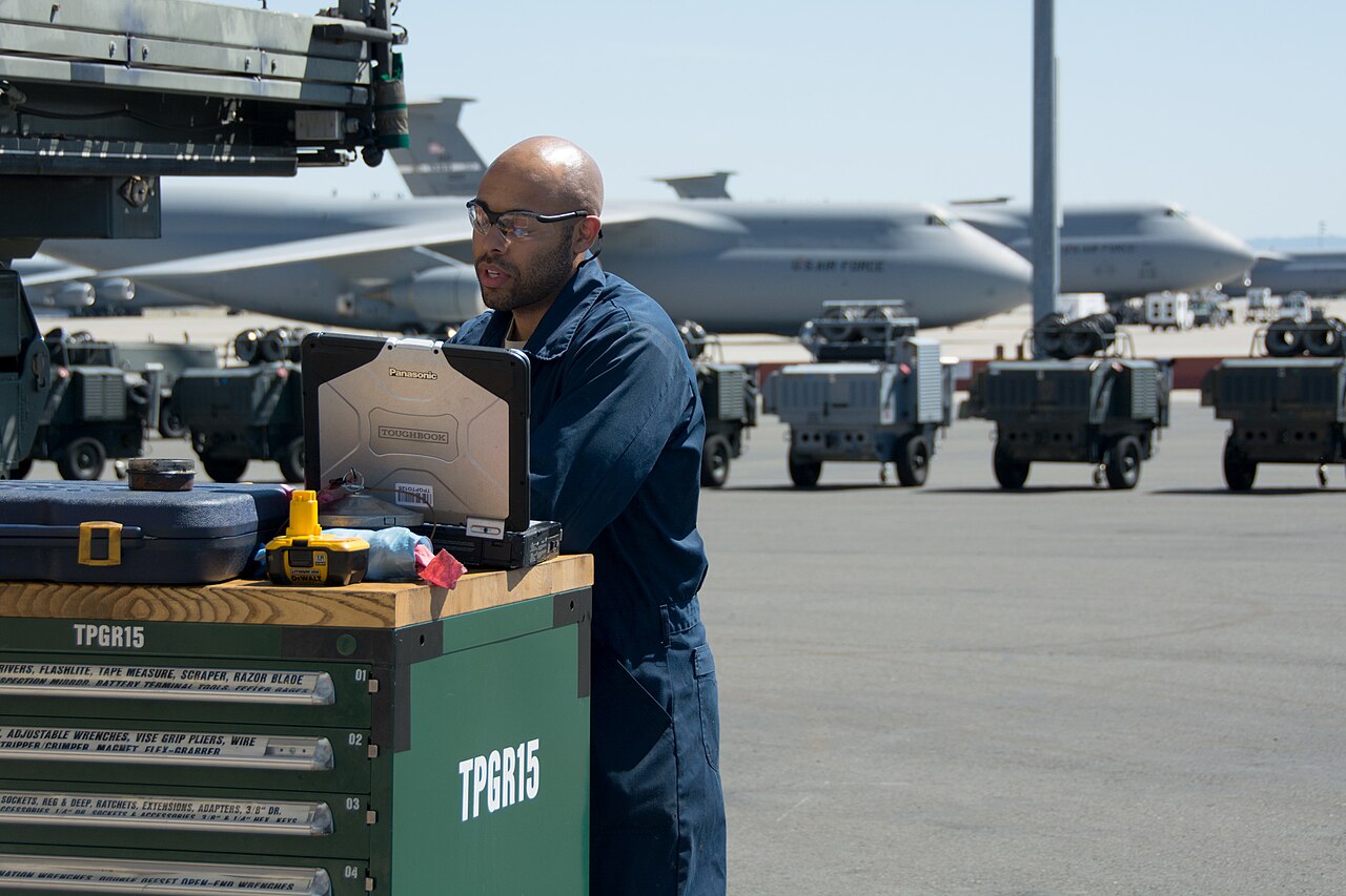 Staff Sgt. Nathan Hilt, 349th Maintenance Squadron aerospace ground equipment mechanic, consults his technical orders on a Panasonic Toughbook at Travis Air Force Base, California.