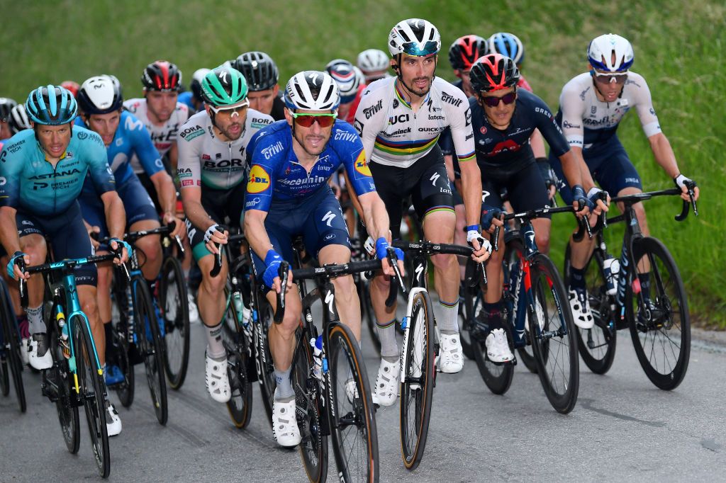 LACHEN SWITZERLAND JUNE 07 Dries Devenyns of Belgium Julian Alaphilippe of France and Team Deceuninck QuickStep during the 84th Tour de Suisse 2021 Stage 2 a 178km stage from Neuhausen am Rheinfall to Lachen UCIworldtour tds tourdesuisse on June 07 2021 in Lachen Switzerland Photo by Tim de WaeleGetty Images