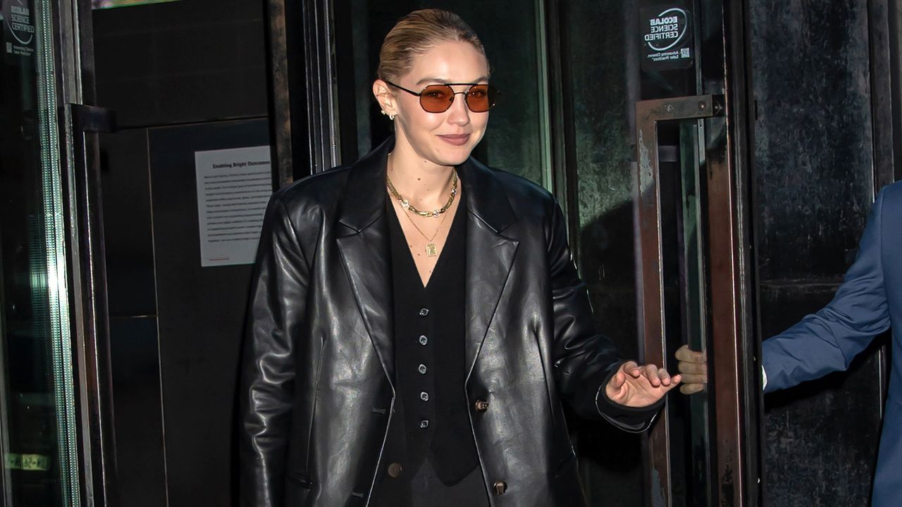 Gigi Hadid wears an all-black suit outfit in New York City.