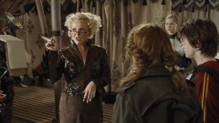 Rita Skeeter talking and pointing