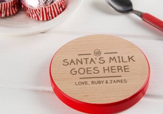teackaes on a place, and coaster for santas milk