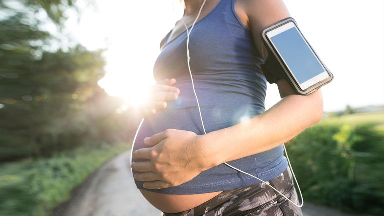 Woman running whilst pregnant