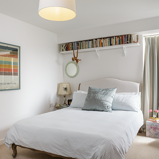 bedroom with white bedlinen and white wall
