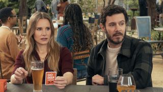 Joanne and Noah sitting at picnic table in nobody Wants This Season 2