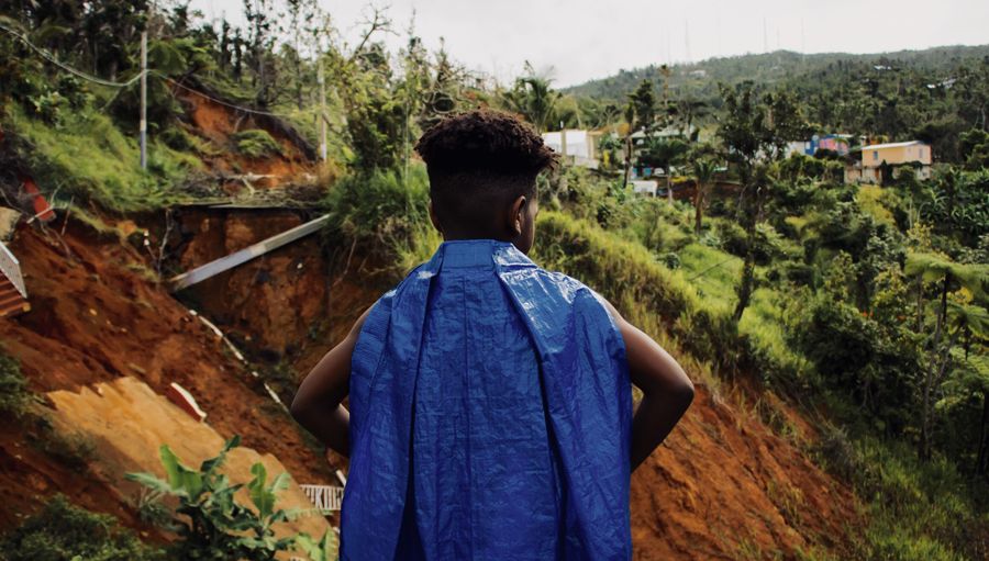 Yanniel A. Arce Rivera portrays Junior, a ten-year-old boy searching for his grandfather’s medicine in hurricane-ravaged Puerto Rico.