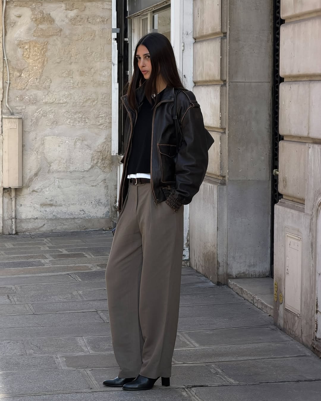 Salome Mory wearing block-heel ankle boots in Paris.