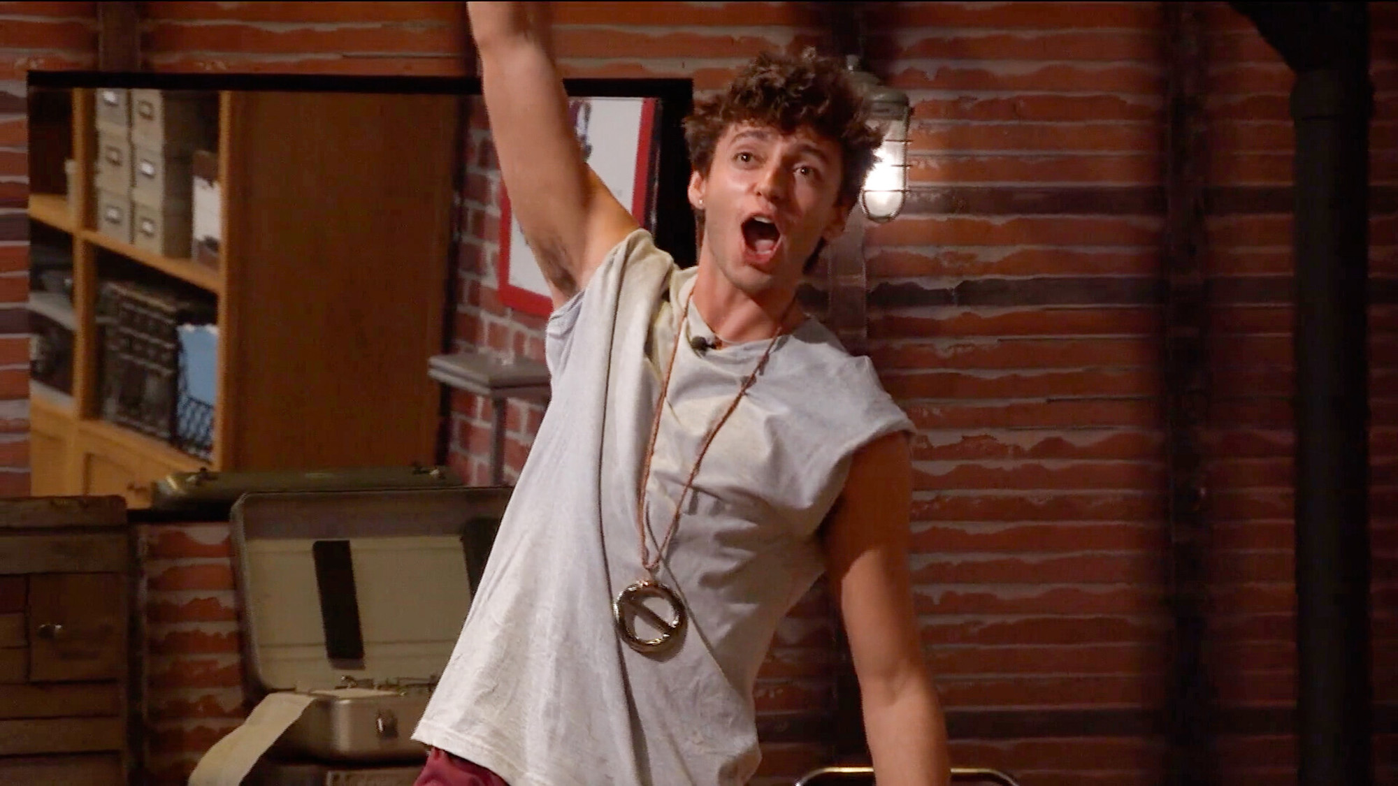 Drew winning Power of Veto and getting off the Block in Big Brother 28. His hair moves as he celebrates.