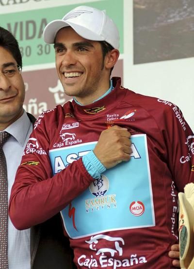 Alberto Contador (Astana) shows some pride in his newfound ownership of the leader's jersey