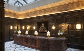 The reception area with dark woods and textural patterned rugs