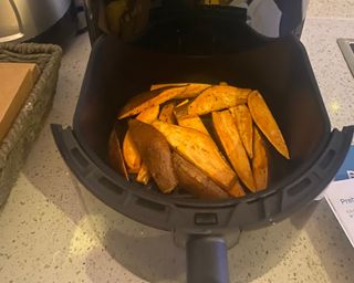 Dreo air fryer review in process cooking sweet potato fries in