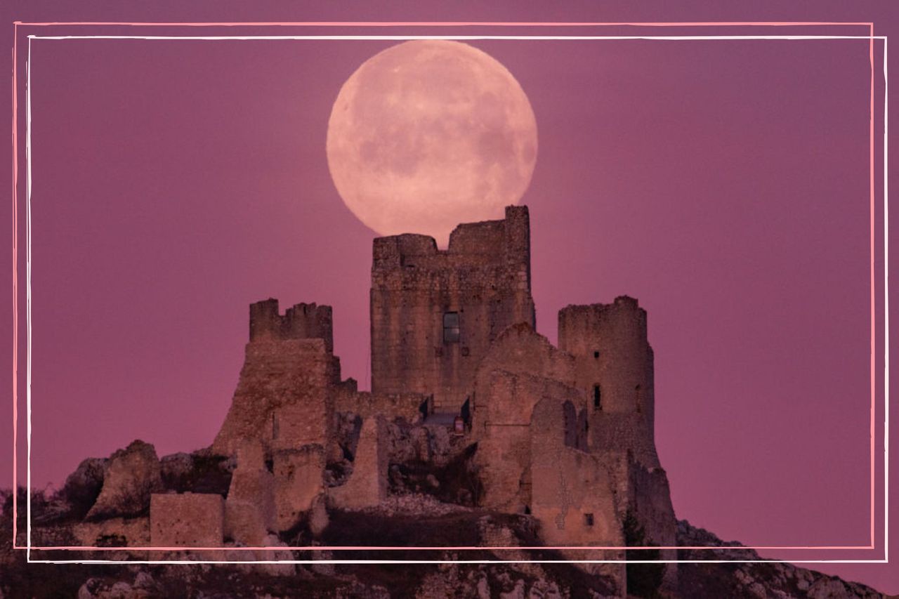 Full moon also known as Snow Moon sets behind Rocca Calascio castle in Calascio (AQ), Abruzzo, Italy, on February 17, 2022