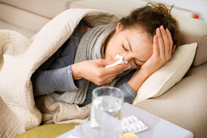 Woman sick on the couch