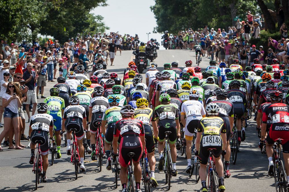 Riders pass back through Golden on the way to the climb