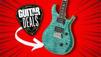 A PRS SE Custom 24 in Turquoise on a bright red background with the Guitar World deals logo