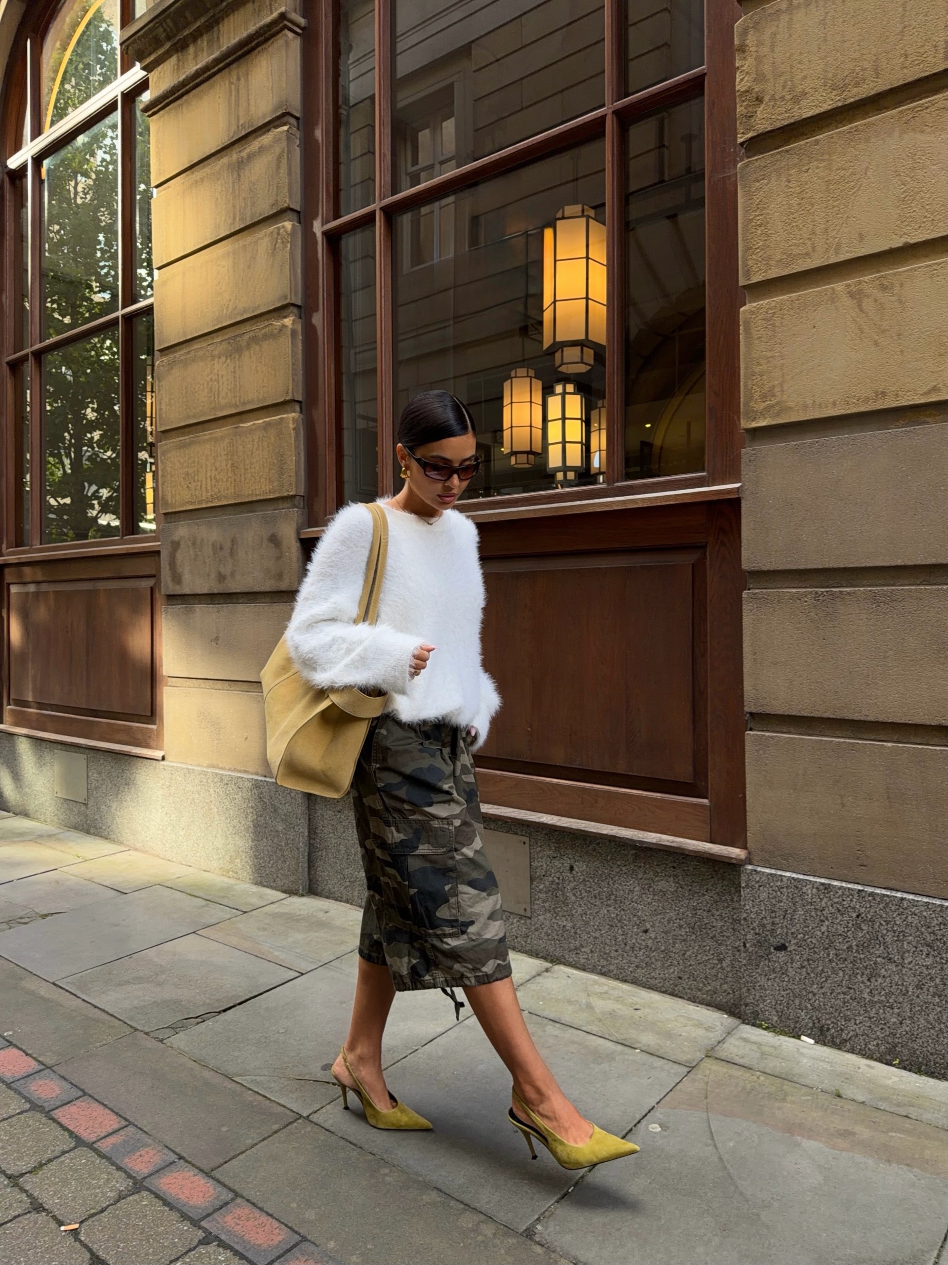 A woman wearing a fall sweater outfit in 2026.