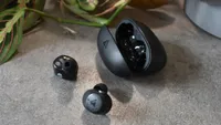 The Lypertek SoundFree S20 wireless earbuds outside of their charging case