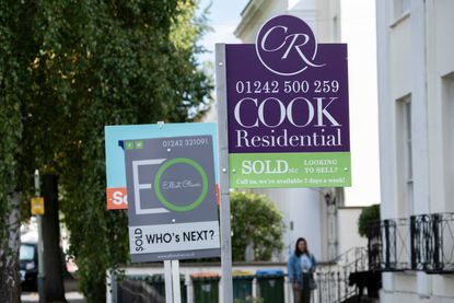 UK house prices signs outside properties for sale (photo by Mike Kemp/In Pictures via Getty Images)