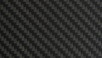 Close-Up of Black Carbon Fibre Surface - stock photoA detailed view of carbon fibre weave texture. Modern, lightweight, and strong, commonly used in high-tech manufacturing and motorsport.