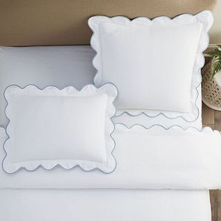 White bedding with scalloped edges