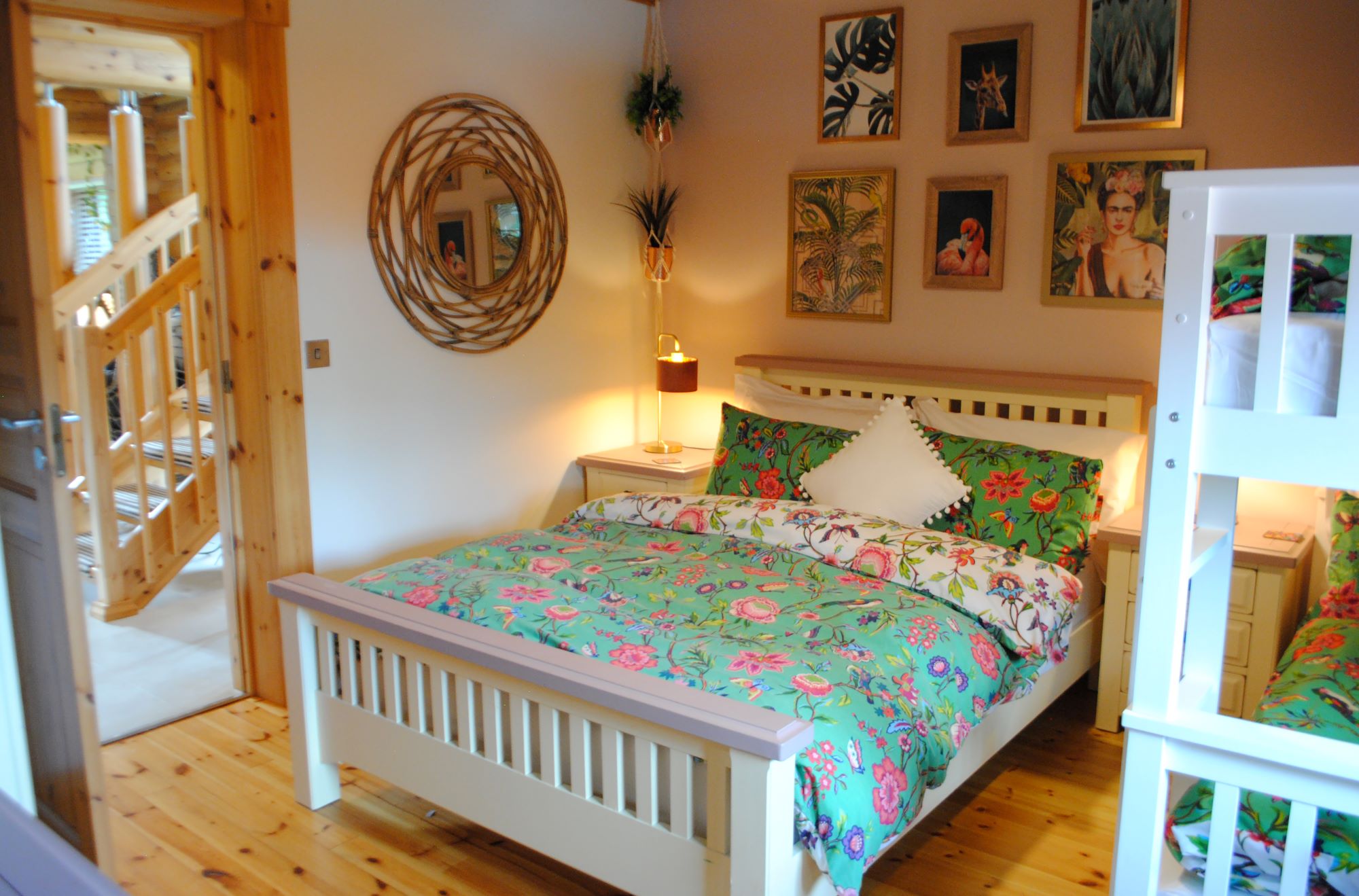 The children's bedroom is downstairs and has one double bed and bunk beds with log wood walls and flooring
