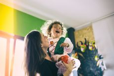 Mother and toddler laughing 