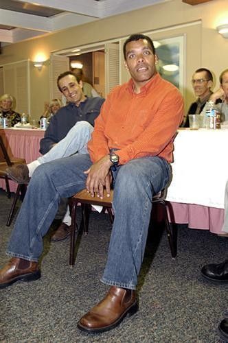 Scott Berryman goes into a trance during Nelson's speech as Roy Knickman looks on.