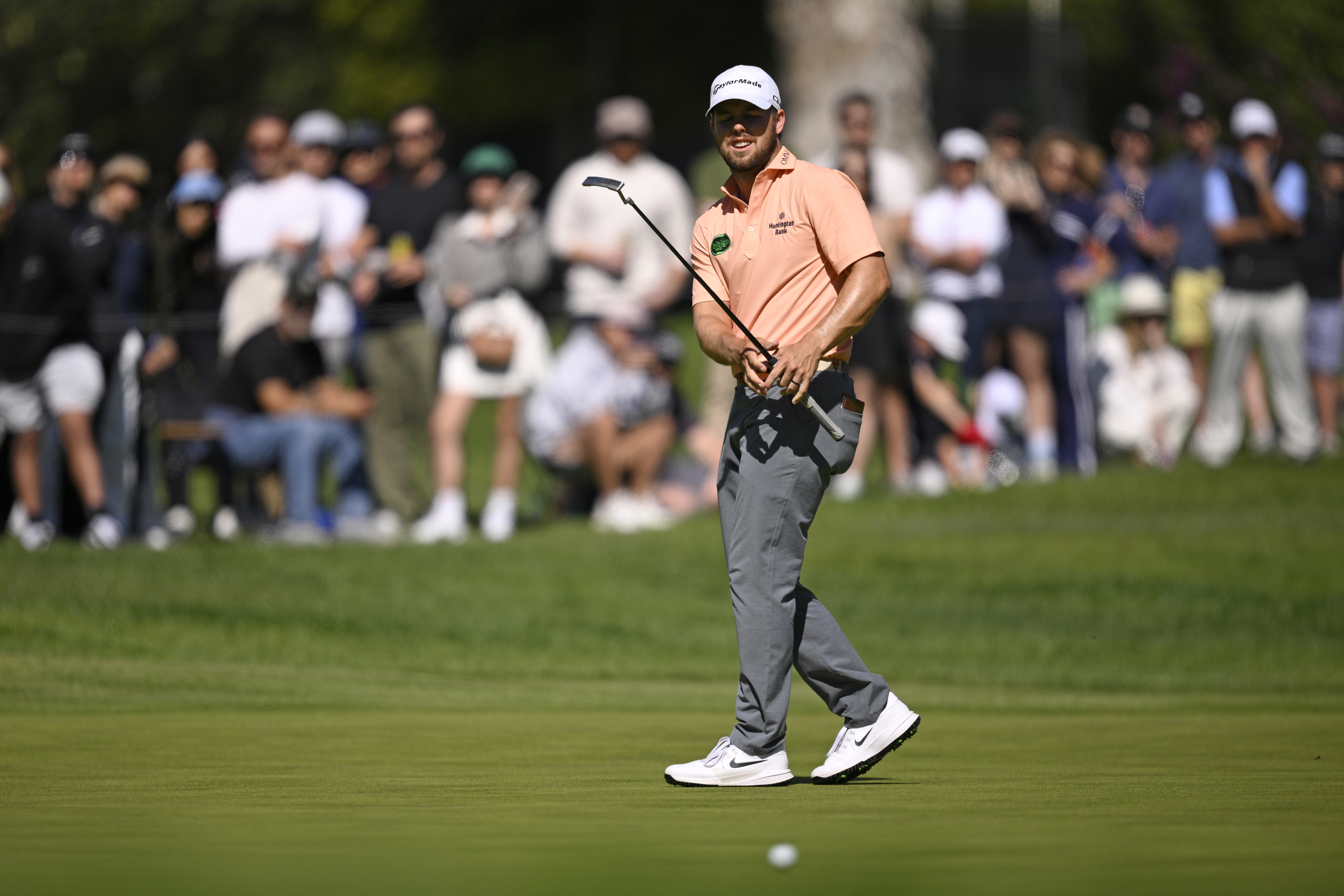 Pierceson Coody hits a putt