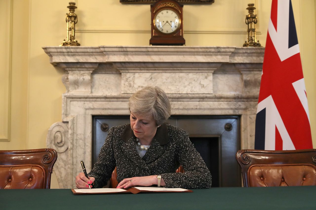 British Prime Minister Theresa May signs a letter invoking Article 50