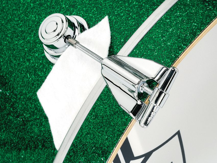 White coated Ambassador logo bass drum heads and felt strip dampers follow the kit's