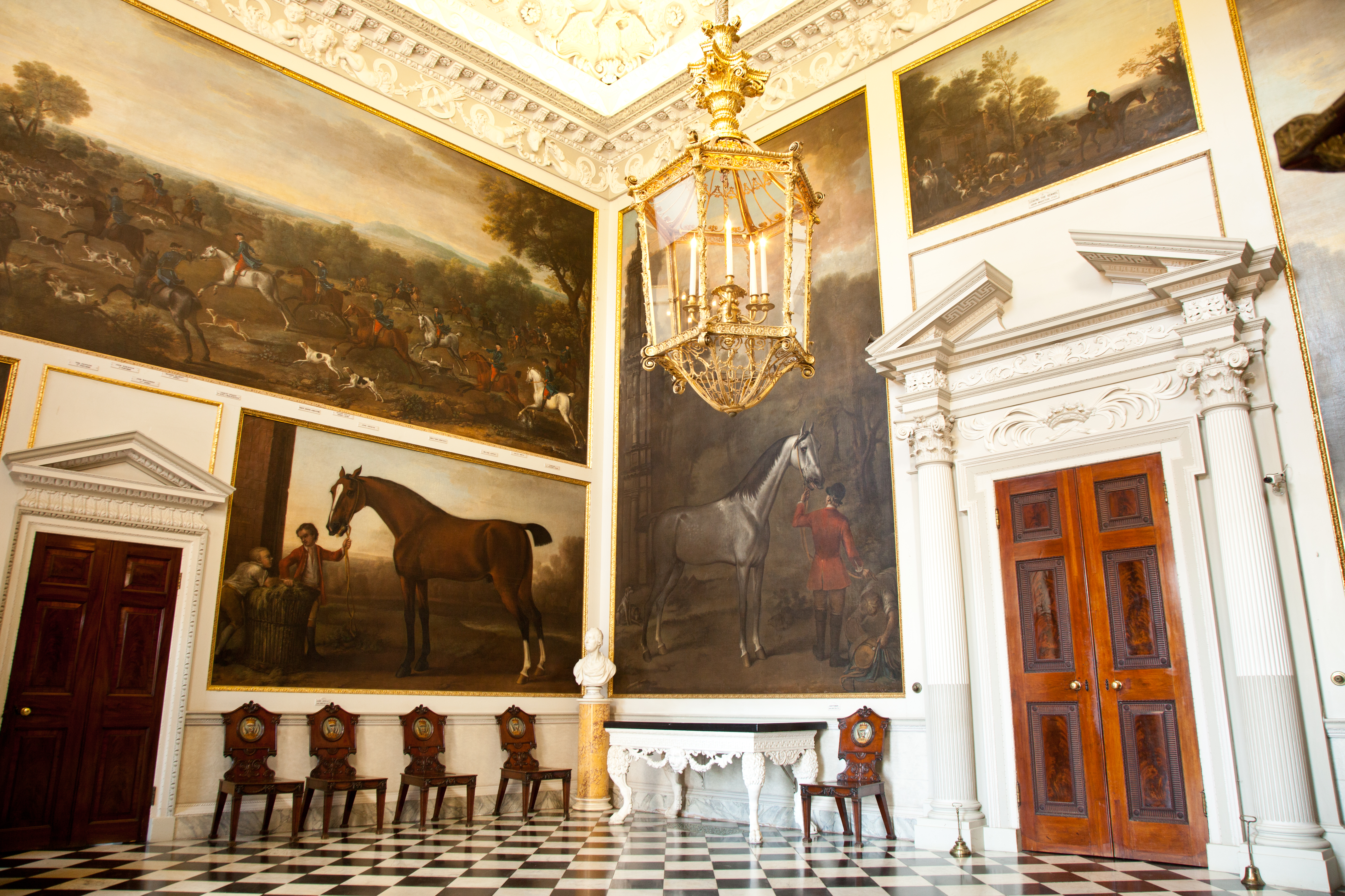 A room with paintings and a black and white floor at Althorp