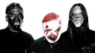 Slipknot’s Paul Gray, Shawn ‘Clown’ Crahan and Mick Thomson posing for a photograph in the masks