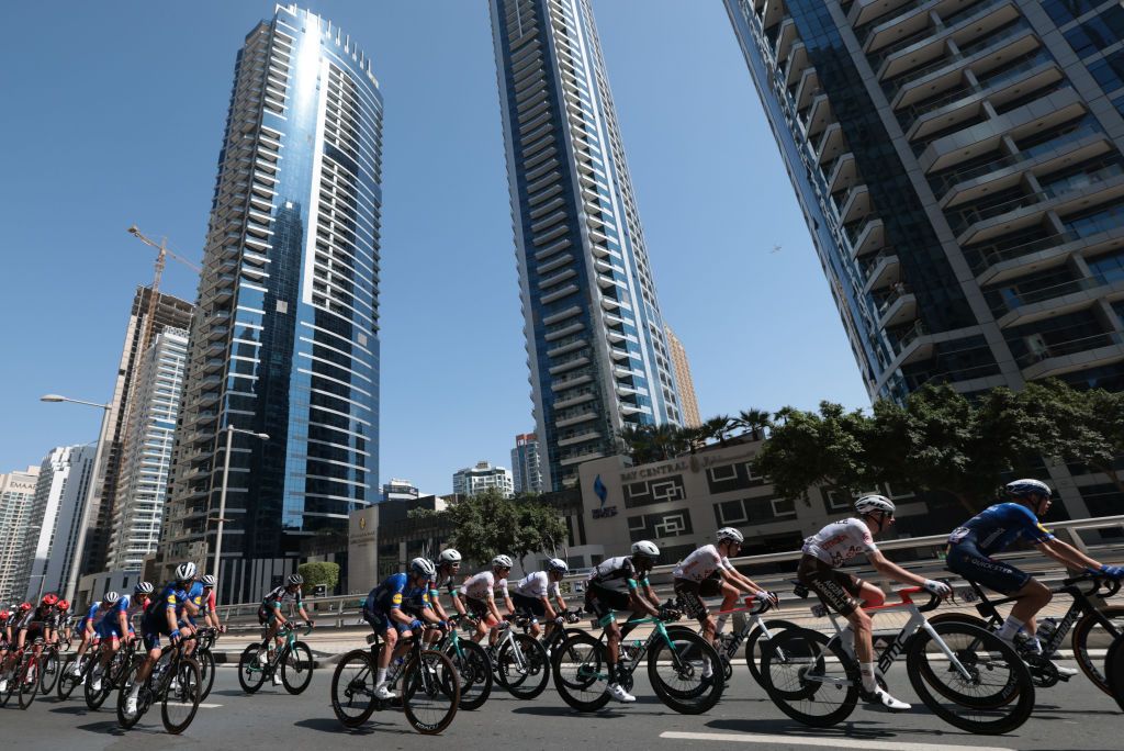 The pack rides during the sixth stage of the UAE Cycling Tour From Dubai Deira Islands to Dubai Palm Jumeriah on February 26 2021 Photo by Giuseppe CACACE AFP Photo by GIUSEPPE CACACEAFP via Getty Images