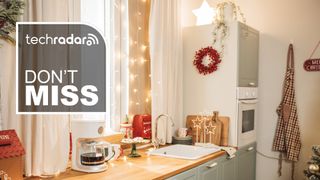 Kitchen with Christmas decorations, with white text reading "TechRadar don't miss"