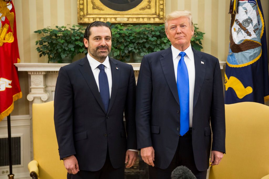 President Trump poses in Oval office.