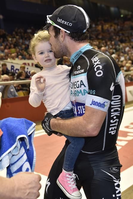 Mark Cavendish kisses his daughter after winning the Madison