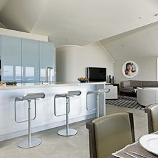 spacious kitchen with central peninsula and rotating corner cabinet