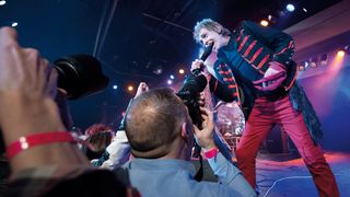 Best lenses for concert photography - photographers shooting a music gig
