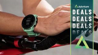 Woman on indoor bike trainer wearing Garmin Forerunner 745 watch