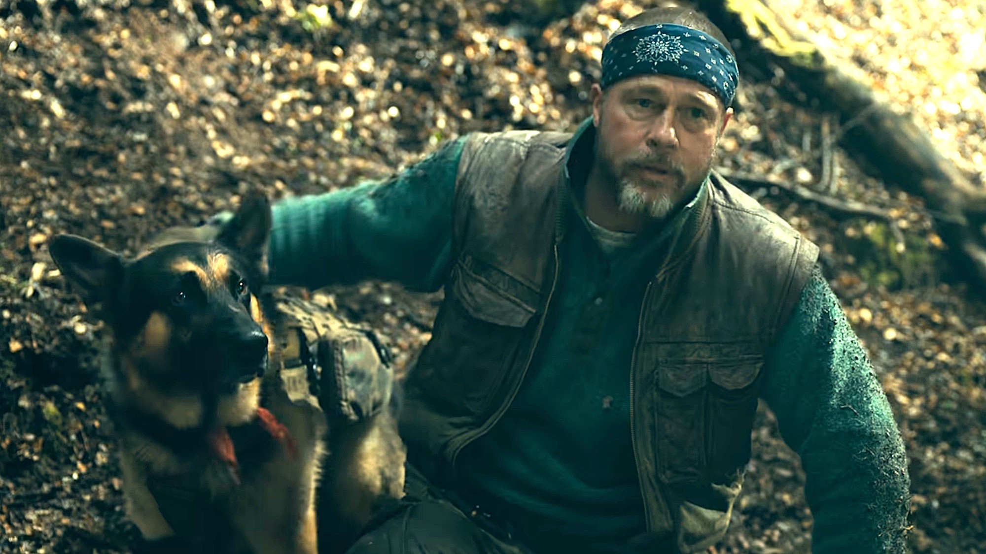 Brad Pitt is shown as James Belmont and canine actor Uber is shown as Odin in Heart of the Beast.
