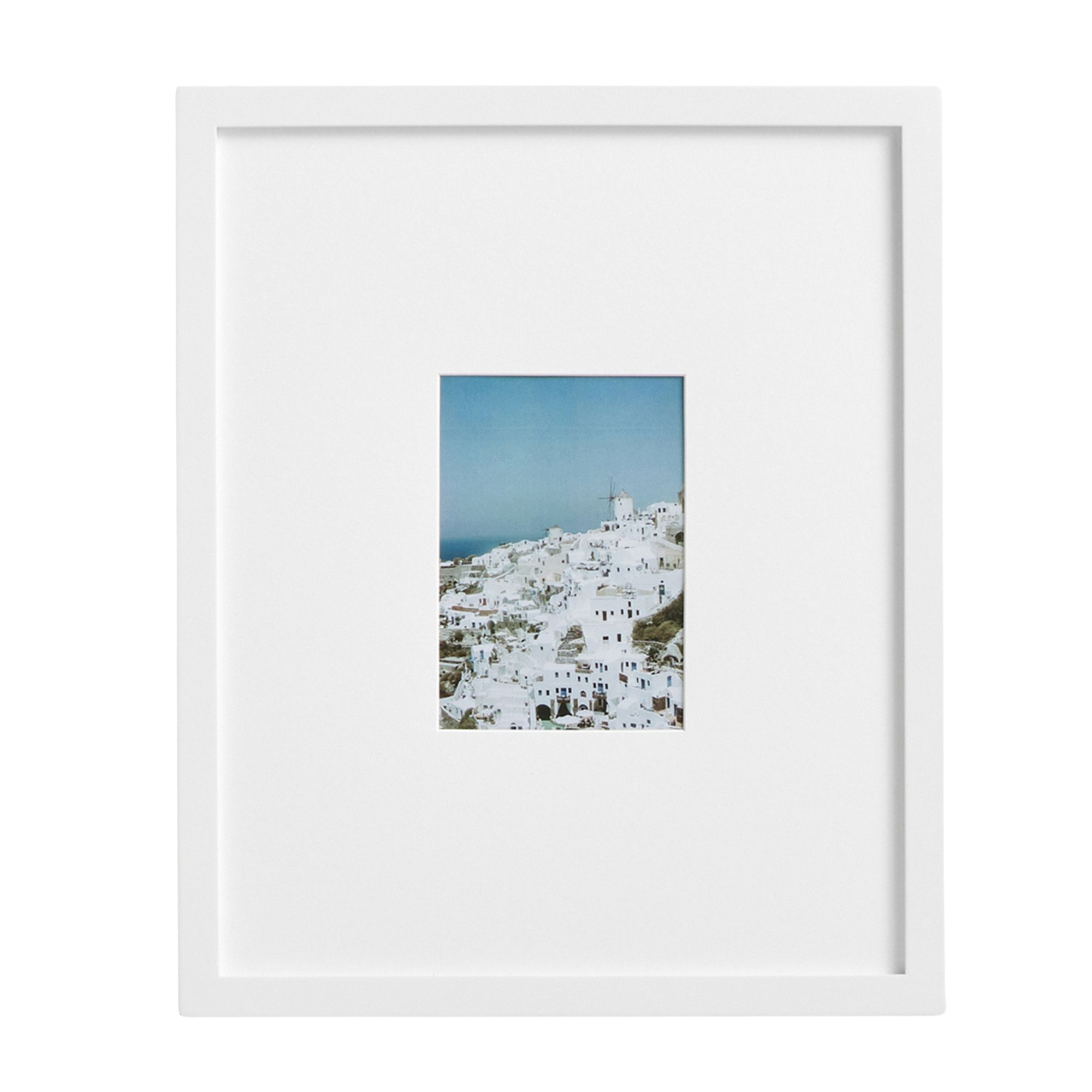 a white picture frame with a small image of a city 