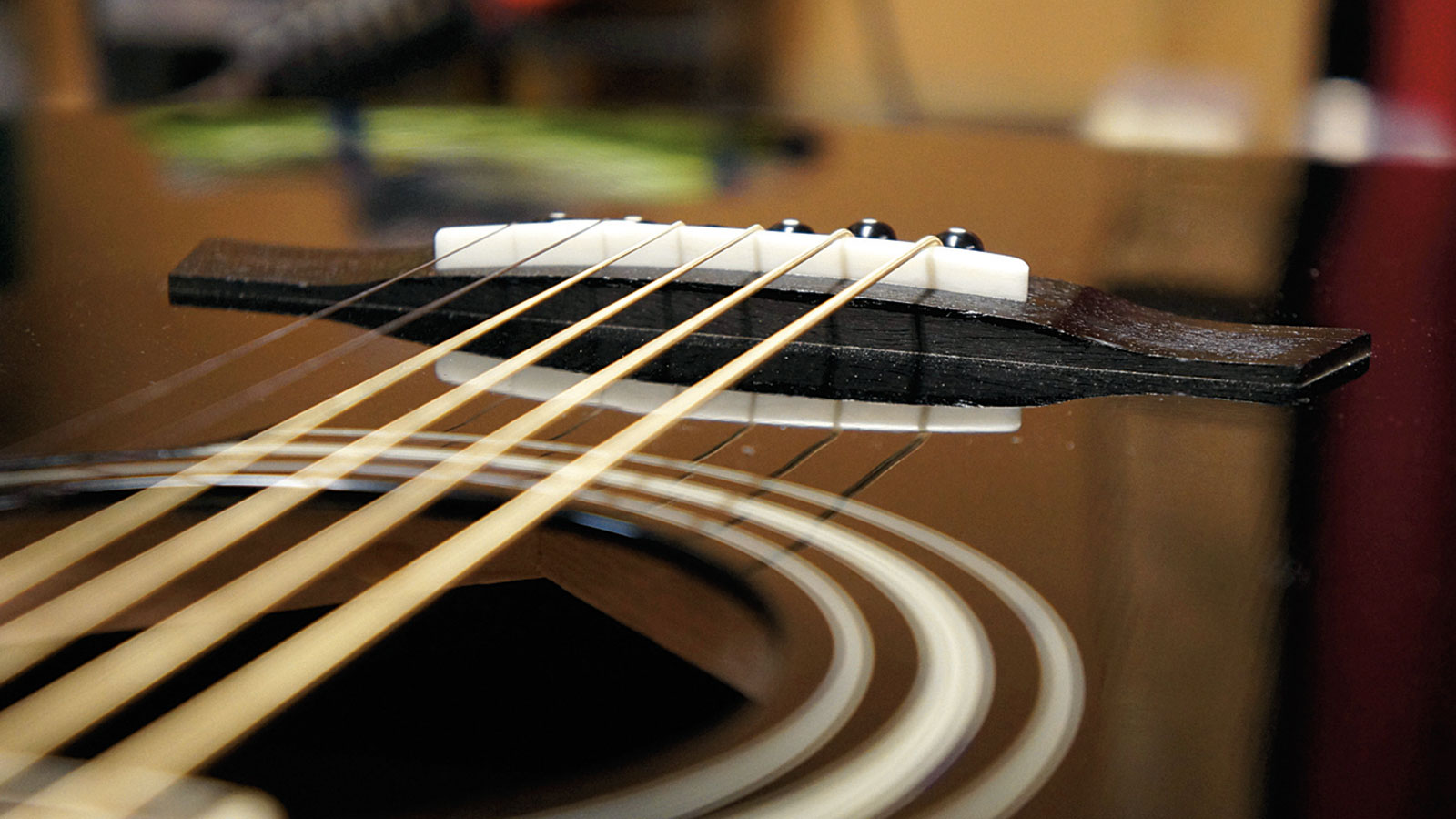 lowering bridge on acoustic guitar