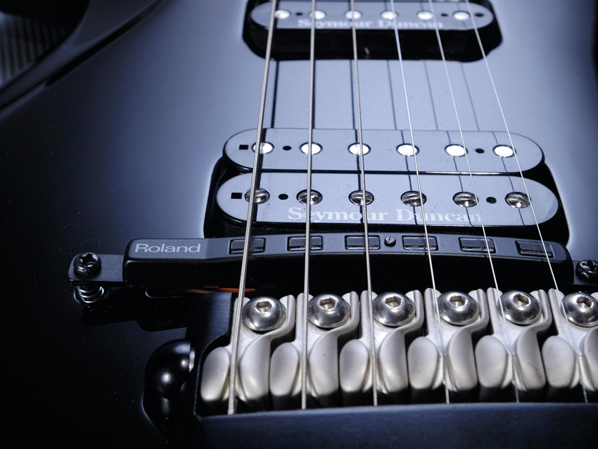 The discrete Roland GK-GT3 pickup in front of the bridge feeds a 13-pin output that works with Roland's VG. GR and GI gear